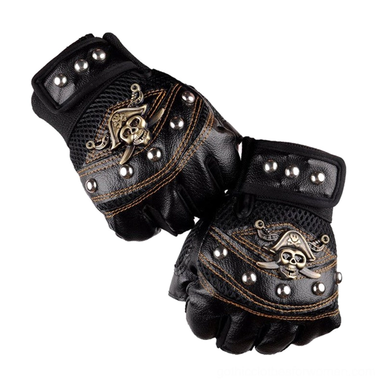 Flat lay top view of black leather skull rivet fingerless gloves with vintage metal studs and stitched seams on white background