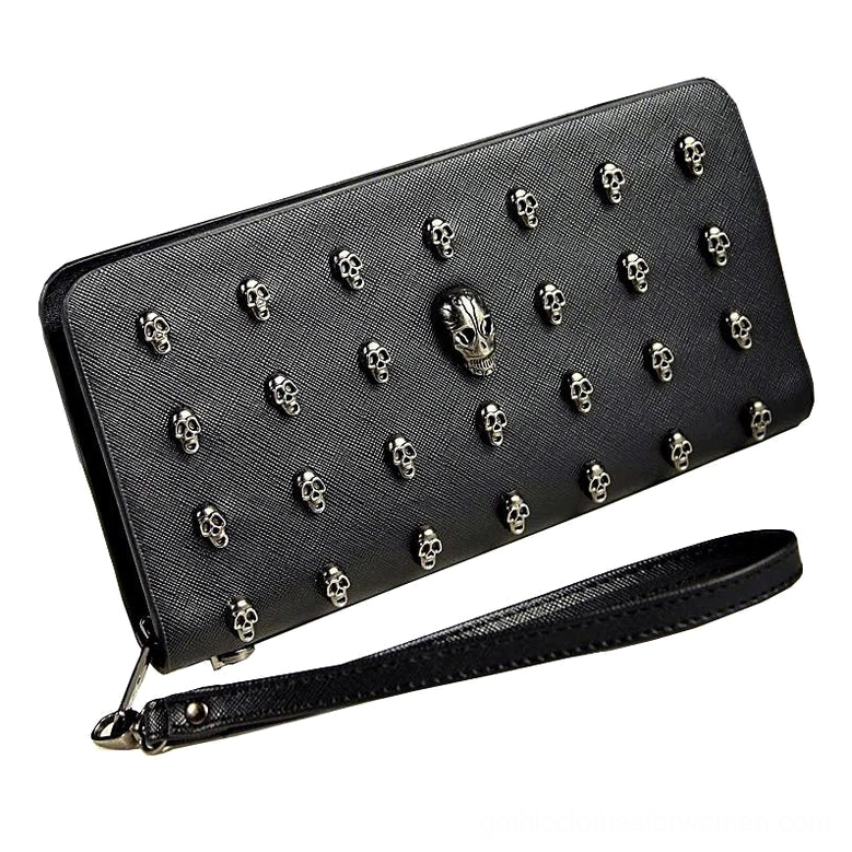 Right oblique view of black skull studded gothic wallet showcasing multiple silver rivet embellishments, large central skull, and detachable wrist strap