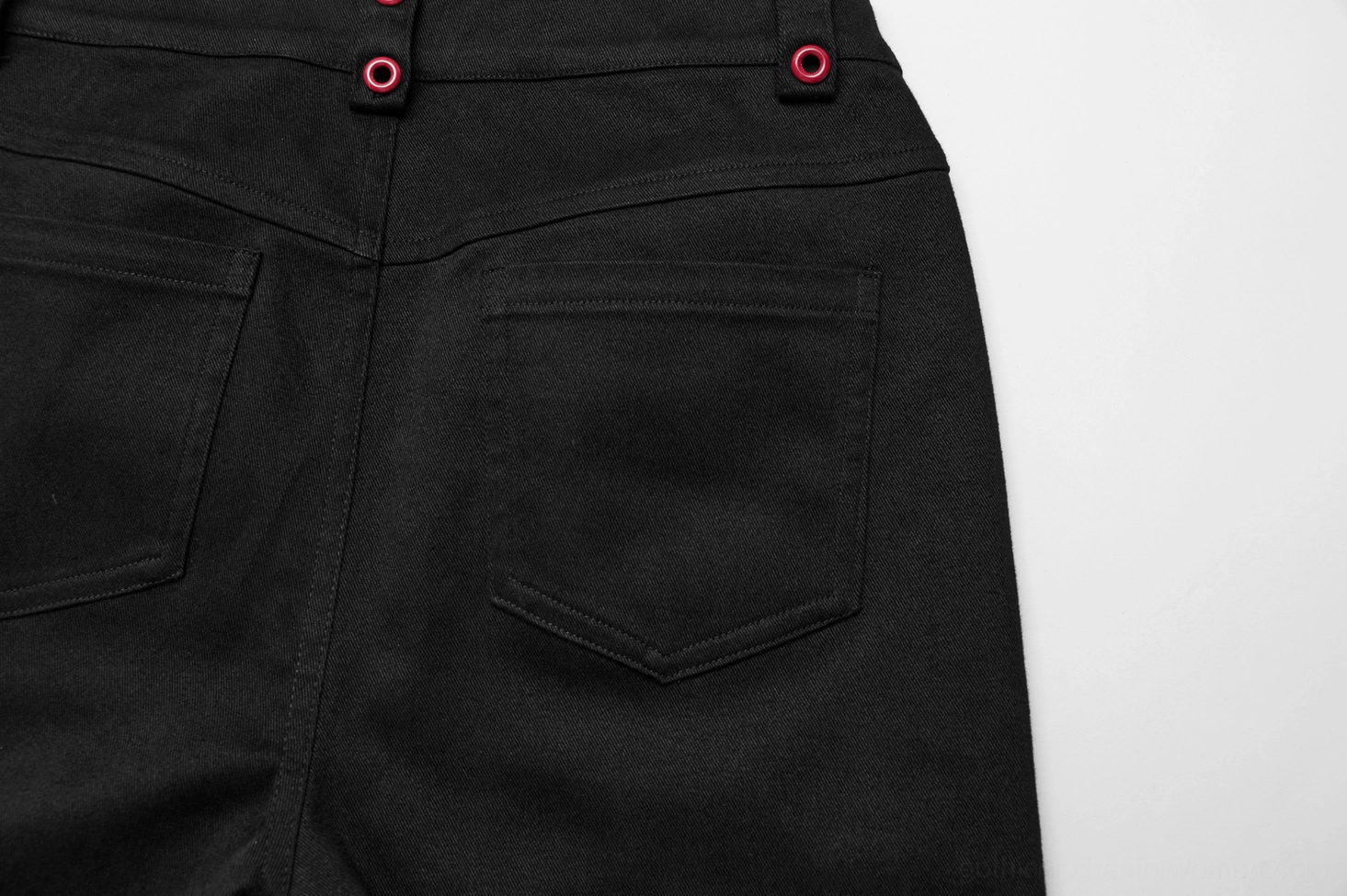 Black and red spiderweb flared gothic trousers flat lay overall product view