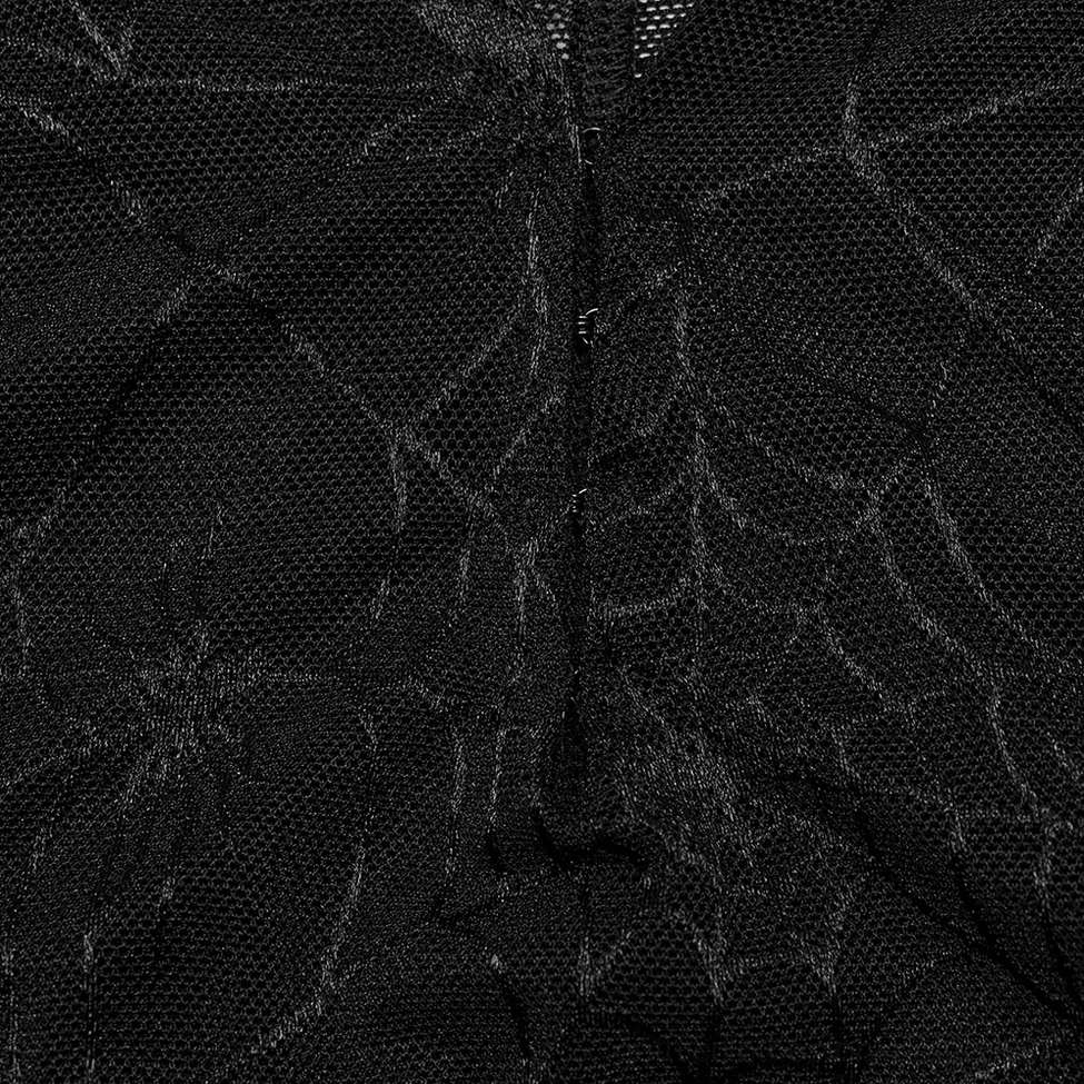 Macro texture detail of black mesh fabric with silver spiderweb pattern and python-like scale texture