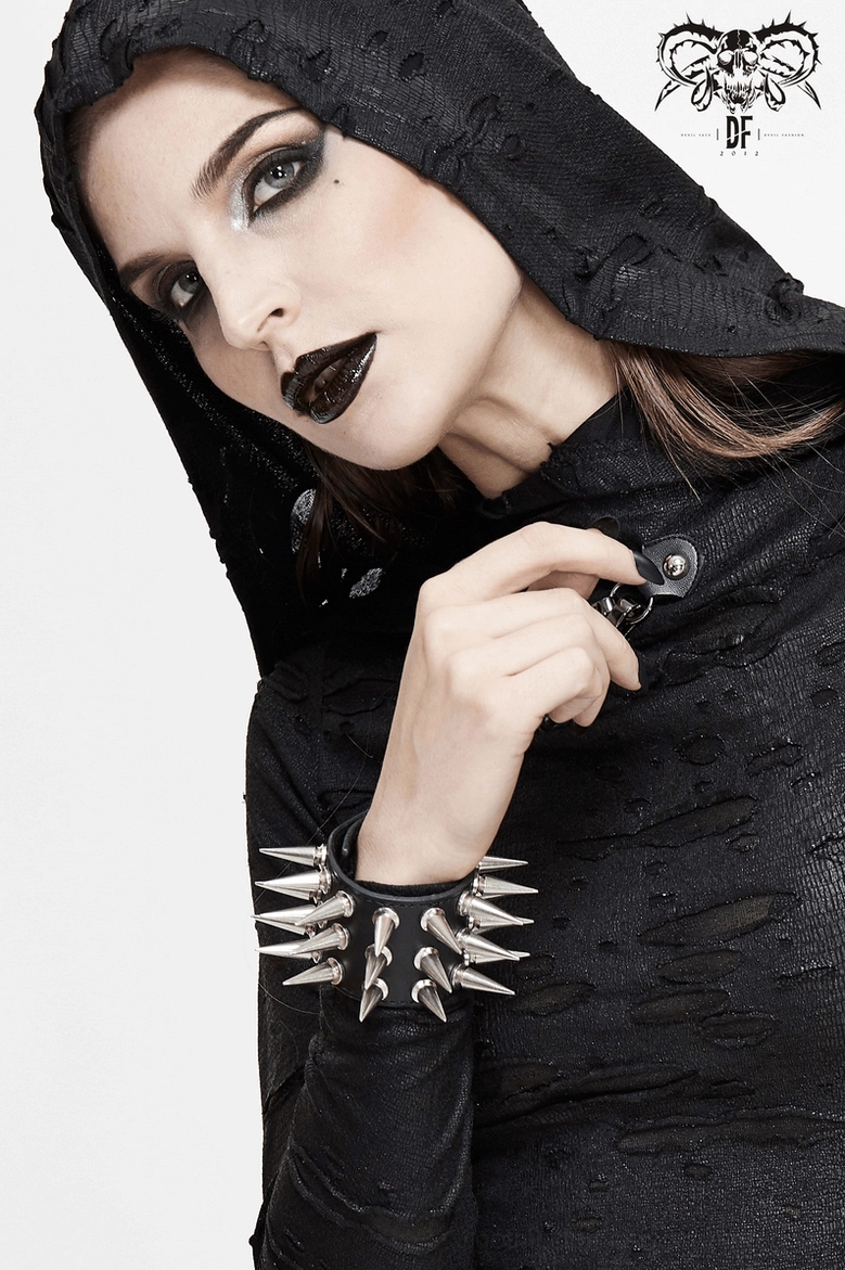 Black spike bracelet worn styling showing how adjustable snap fasteners customize fit for different wrist sizes