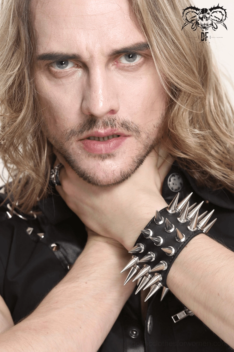 Alternative fashion spike bracelet detail shot emphasizing silver metallic cone studs and adjustable fit system