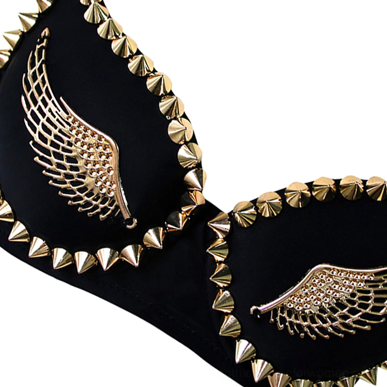 Close-up detail of gold metallic angel wing appliqué on black gothic bustier cup