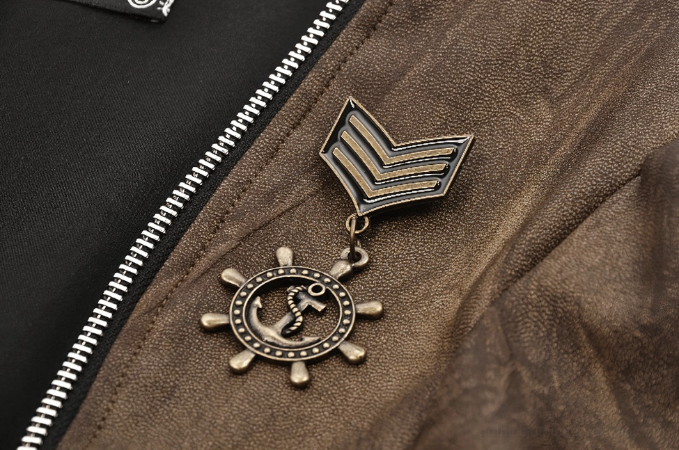 Steampunk bolero metal brooches macro detail featuring anchor-wheel and chevron shapes with exposed silver zipper