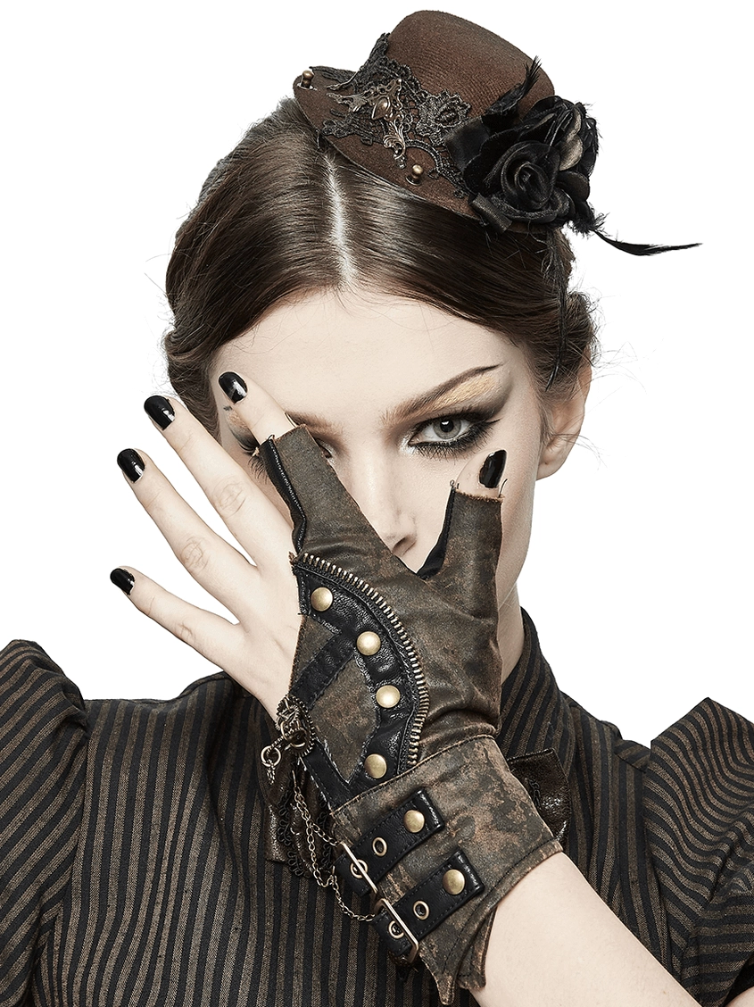 Close-up of steampunk glove showing zipper trim and antique brass rivets in distressed brown leather