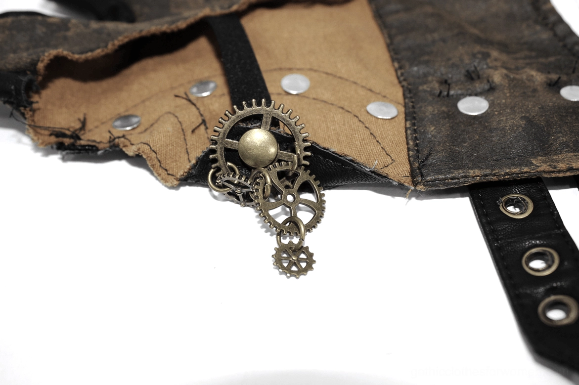 Interior detail of steampunk glove showing gear charms fabric lining and metal snap fasteners