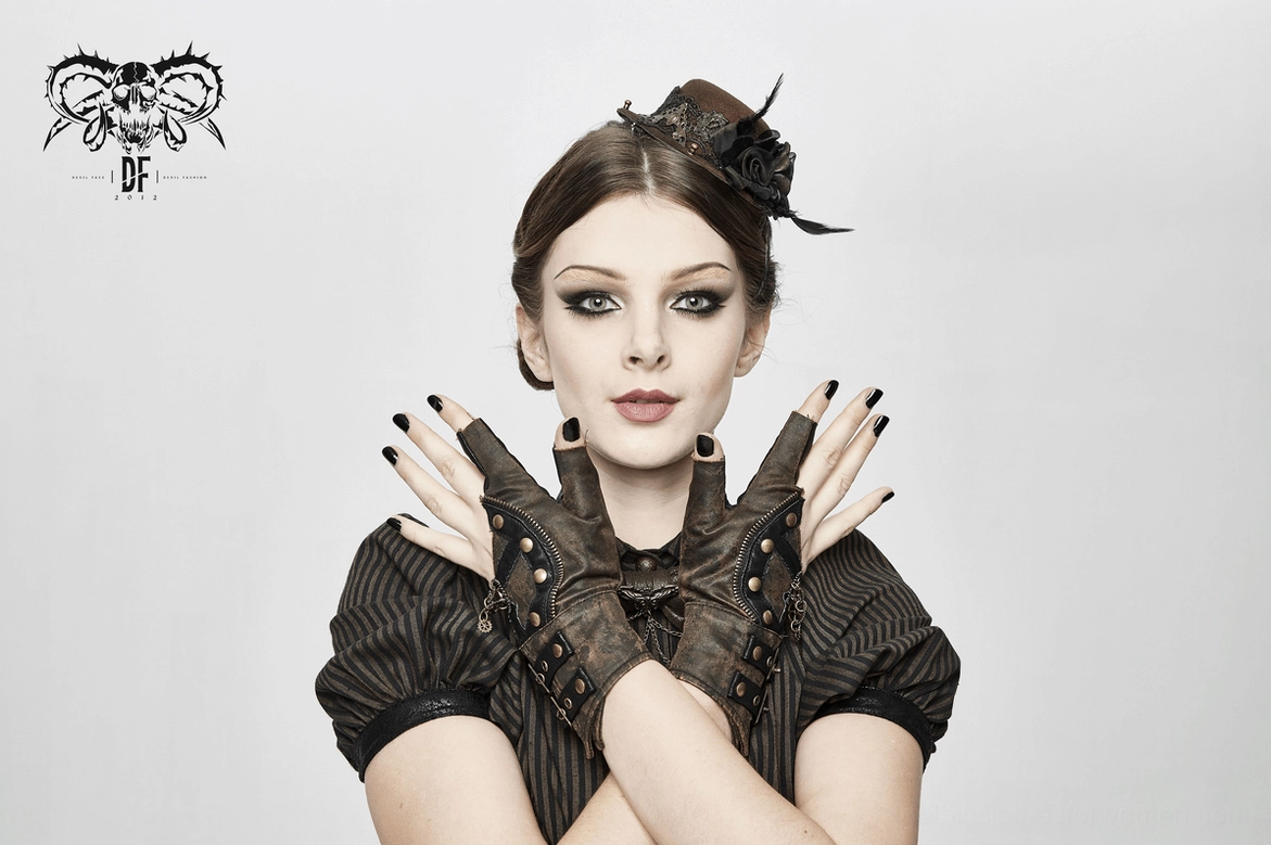 Steampunk fingerless gloves close-up detail shot highlighting distressed leather and industrial metal accents