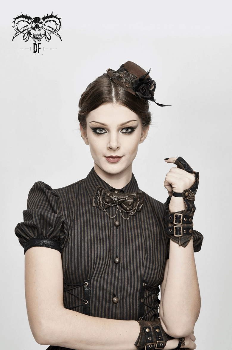 Female model wearing brown steampunk fingerless gloves on both wrists paired with vintage steampunk outfit