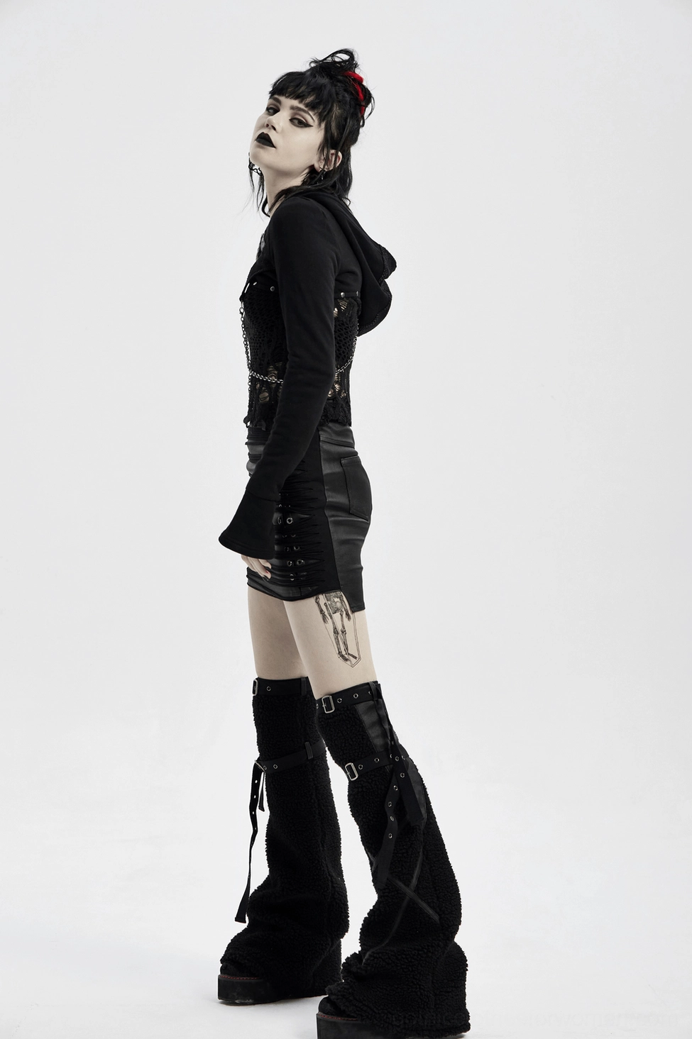 Full-length view of black PU leather steampunk skirt showcasing slim fit and industrial metal hardware