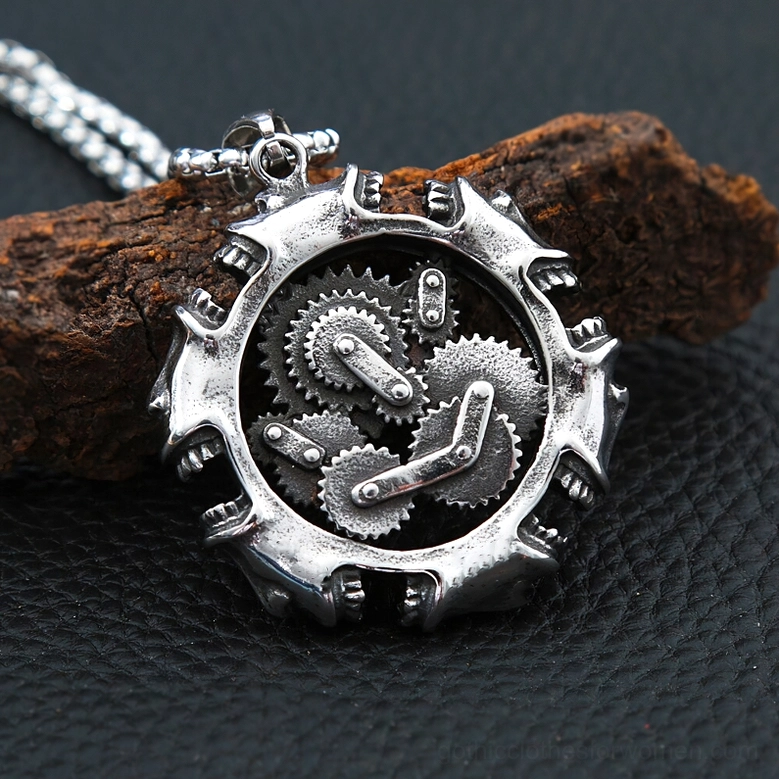 Three-quarter front view of gothic steampunk gear skull pendant with detailed internal mechanism on leather background