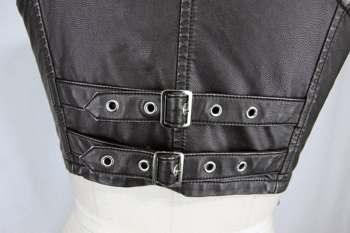 Waist strap detail of steampunk vest showing dual buckle straps with metal eyelet reinforcement