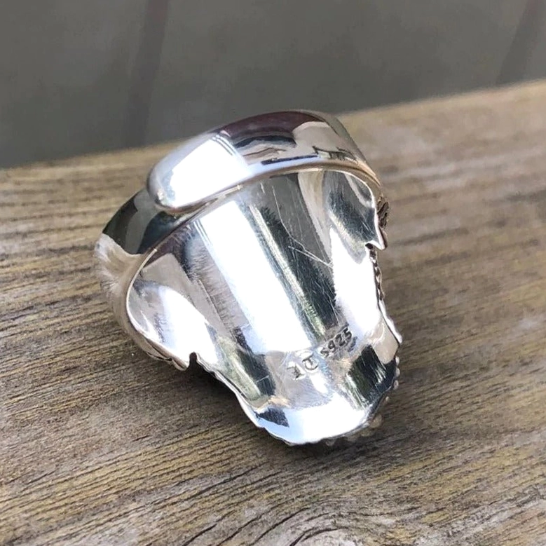 Ring inner band top-down view showing authentic 925 sterling silver hallmark stamp and metal quality details
