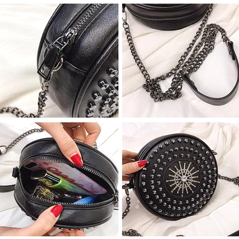 Round black leather bag back view showing plain exterior and chain attachment