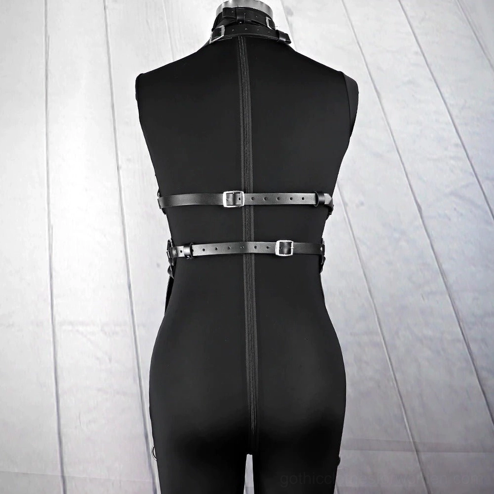 Synthetic leather chest harness with polished metal accents showcasing gothic alternative fashion aesthetic and quality construction