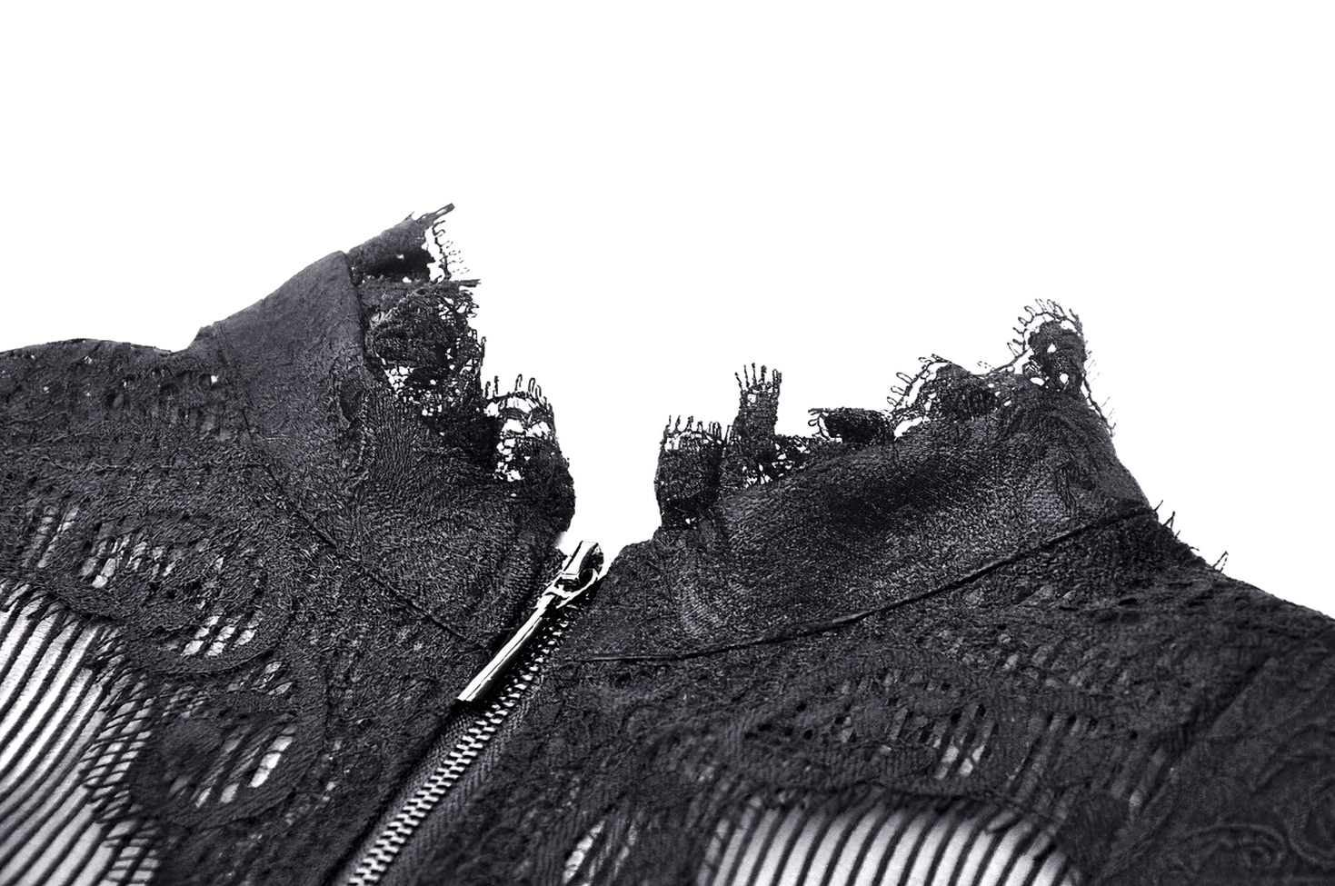 Close-up detail of black tailcoat showing ruffled lace trim, metal zipper, and sheer mesh panel