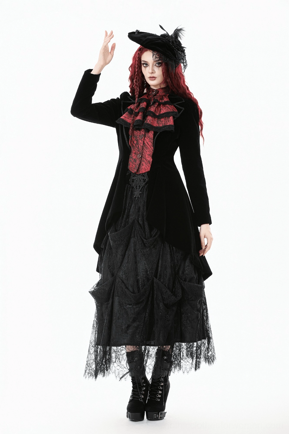 Tailcoat worn on model showing how wine red ruffled panel creates dramatic visual statement and elegant movement
