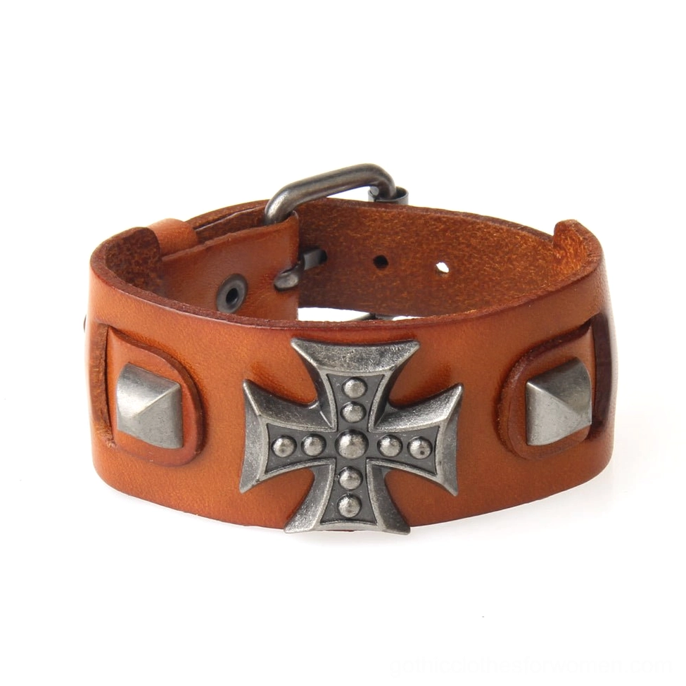 Tan leather gothic cross cuff bracelet side view, showing open buckle design and metal hardware details