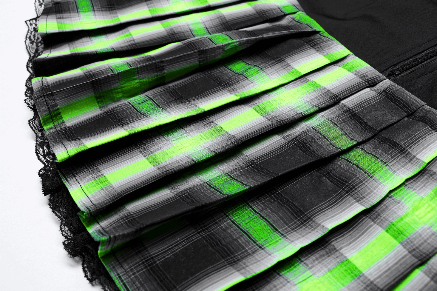 Alternative angle detail of tartan pleats and lace construction on gothic mini skirt