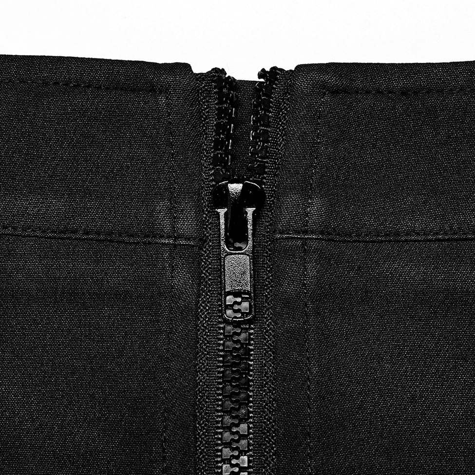 Extreme close-up of heavy-duty plastic zipper closure on back of tartan gothic pleated skirt