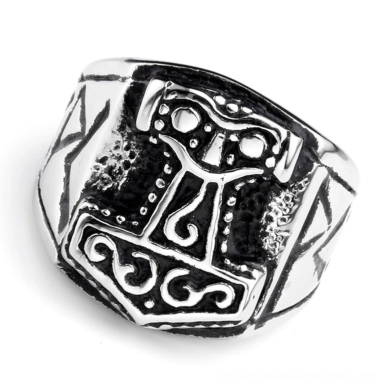 Thor's hammer ring with heavily engraved runes and Viking motifs, flat front studio view on white background