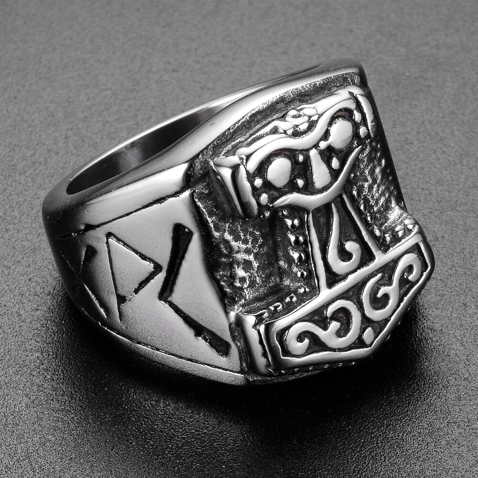 Thor's hammer Viking ring with silver-black aged finish and engraved rune scrollwork, front oblique detailed view