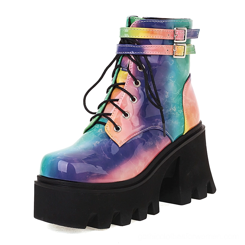 Tie-dye blue purple pink patent leather platform boots with dual buckle straps and lace-up closure, side three-quarter profile view