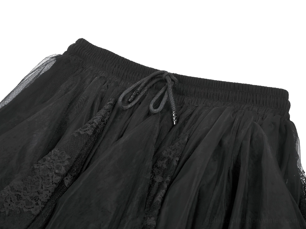 Close-up detail of black tulle skirt elastic drawstring waistband and lace fabric