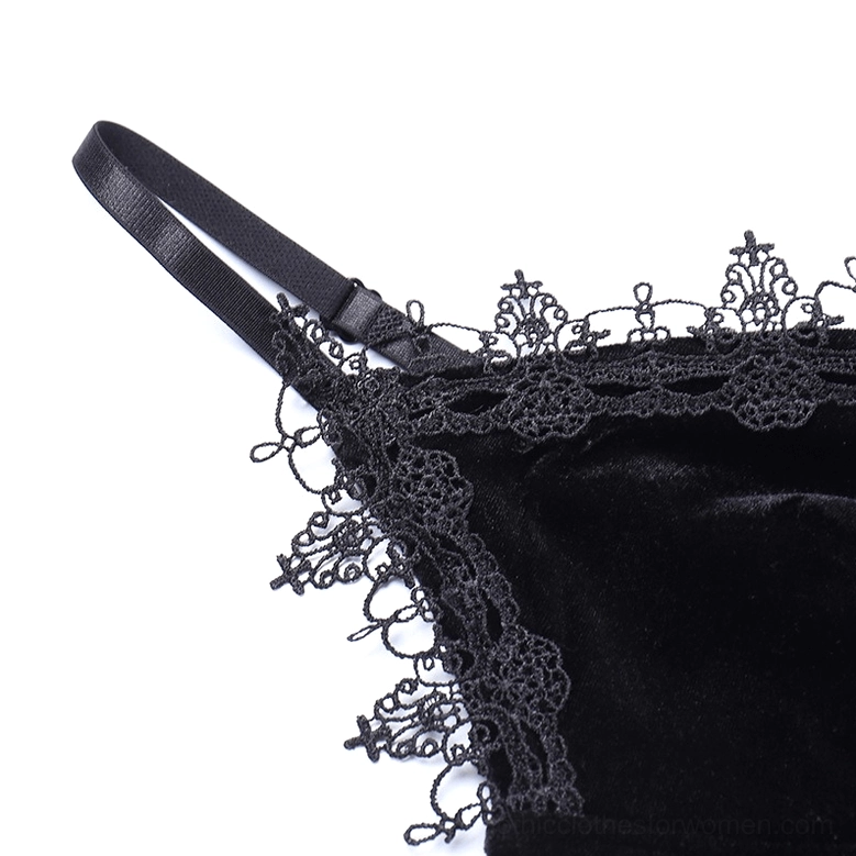 Detail shot of adjustable spaghetti strap and embroidered lace trim on black velvet dress