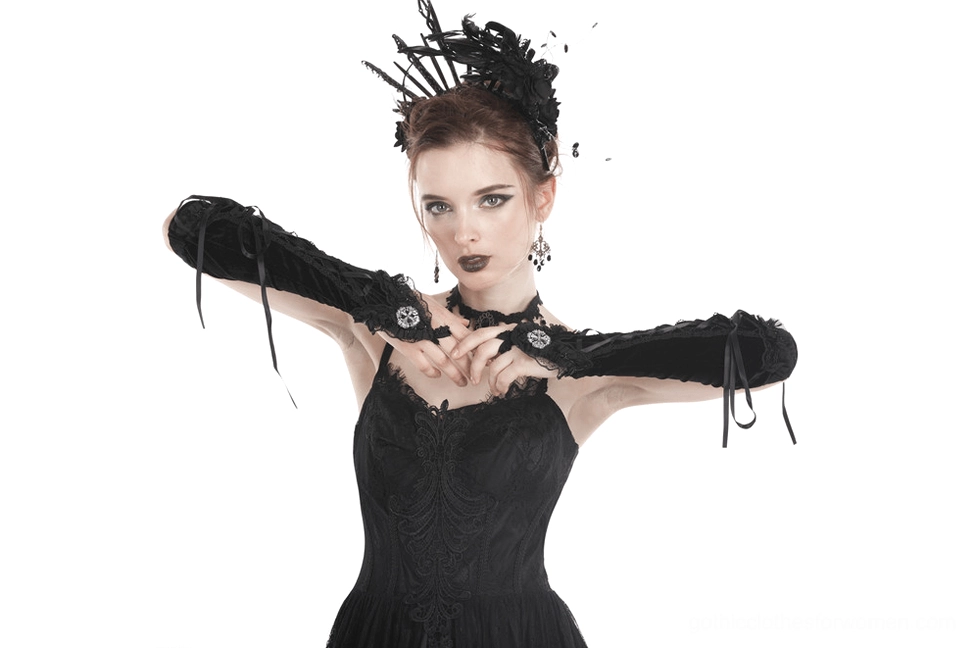 Black velvet fingerless gloves showcasing intricate cross lace-up construction and decorative metal accents for alternative gothic fashion