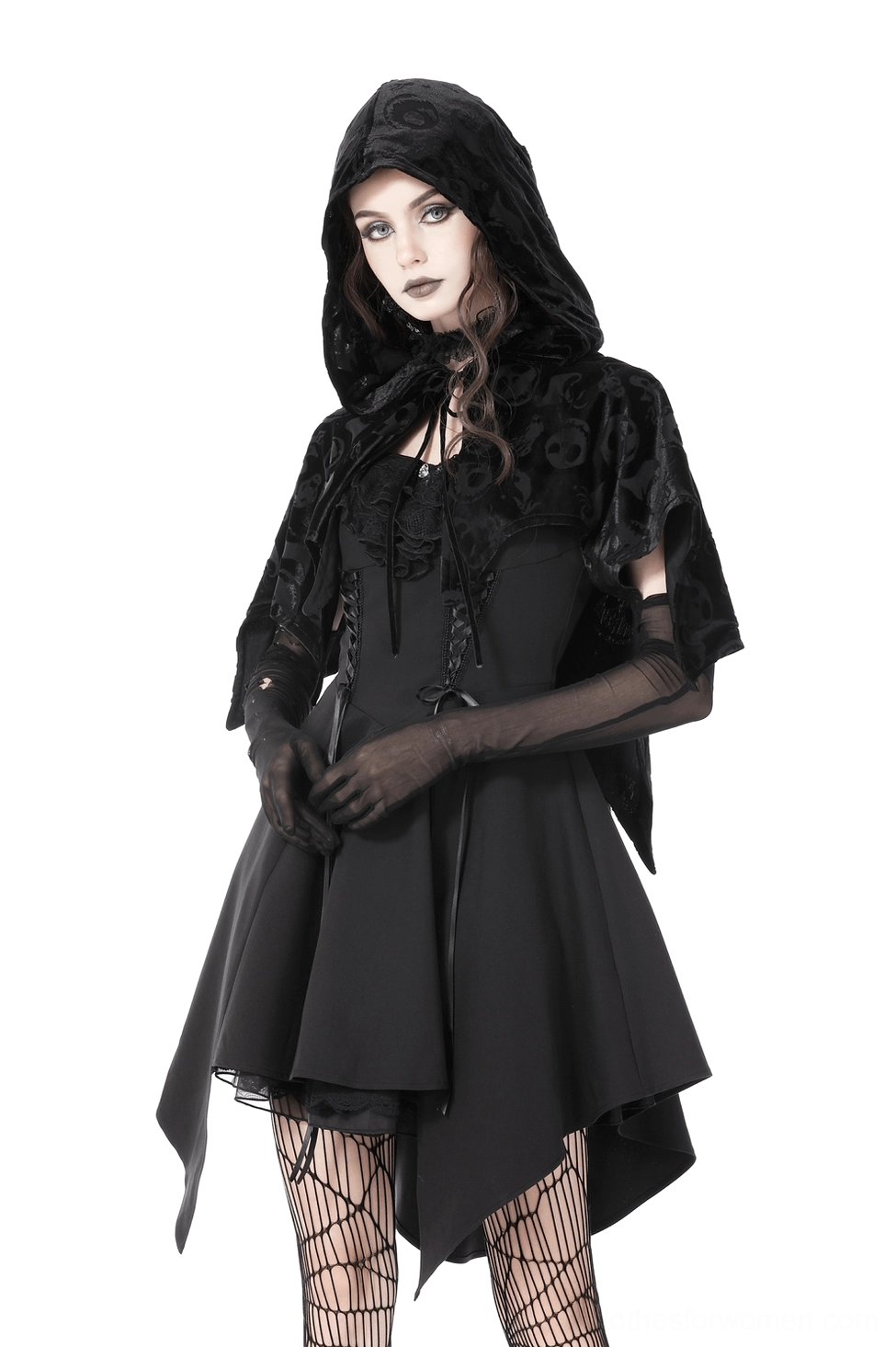 Velvet gothic cape styling angle, skull print embossed design, theatrical silhouette, black fabric drape