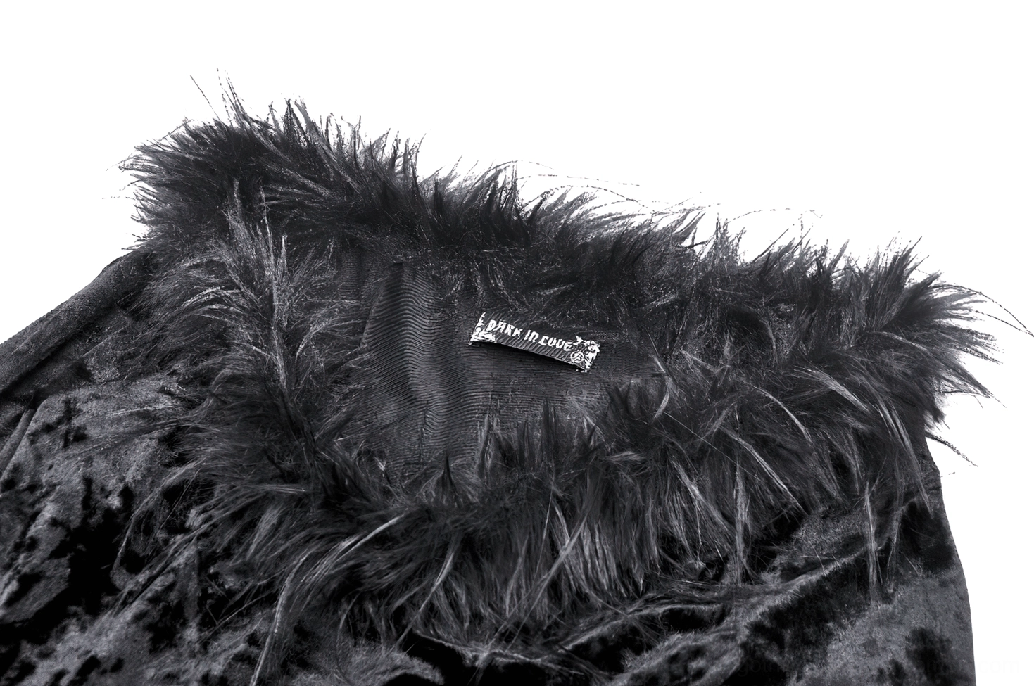 Close-up detail of black velvet dress feathered collar trim and furry neckline, showing premium craftsmanship