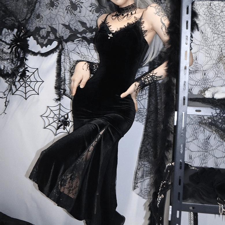 Black velvet mermaid dress with cross pendant and lace trim, design detail focus