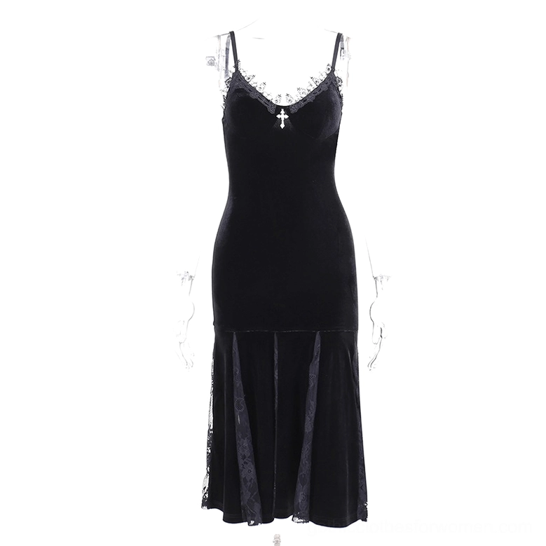 Black velvet mermaid dress with lace panel and cross pendant on dress form, front view