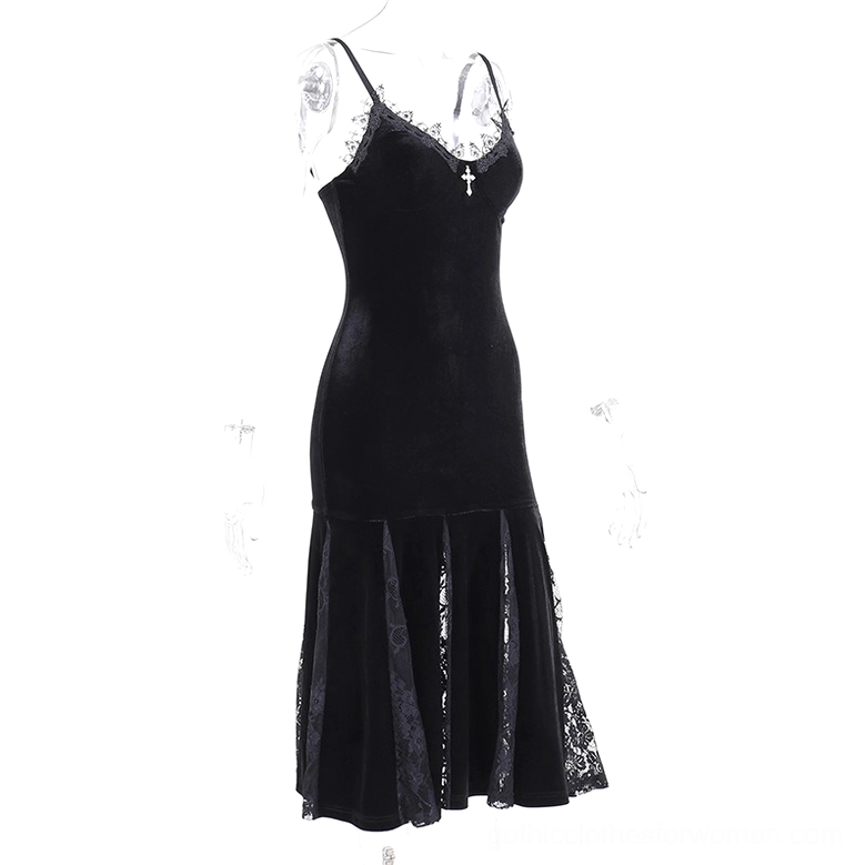 Black velvet mermaid dress with embroidered lace side panel and cross embellishment, three-quarter view