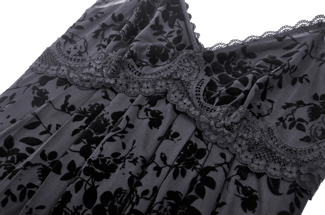 Close-up of velvet burnout rose print and scalloped lace trim on gothic maxi dress bodice