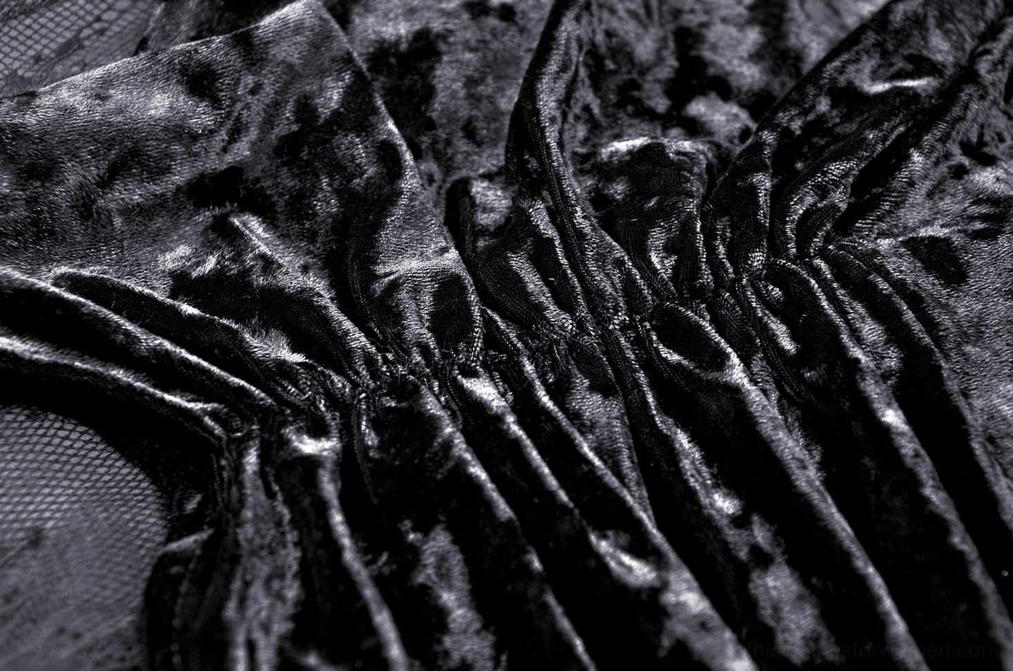 Close-up of deep folded velvet ruches showing soft crushed texture and dimensional sculpting