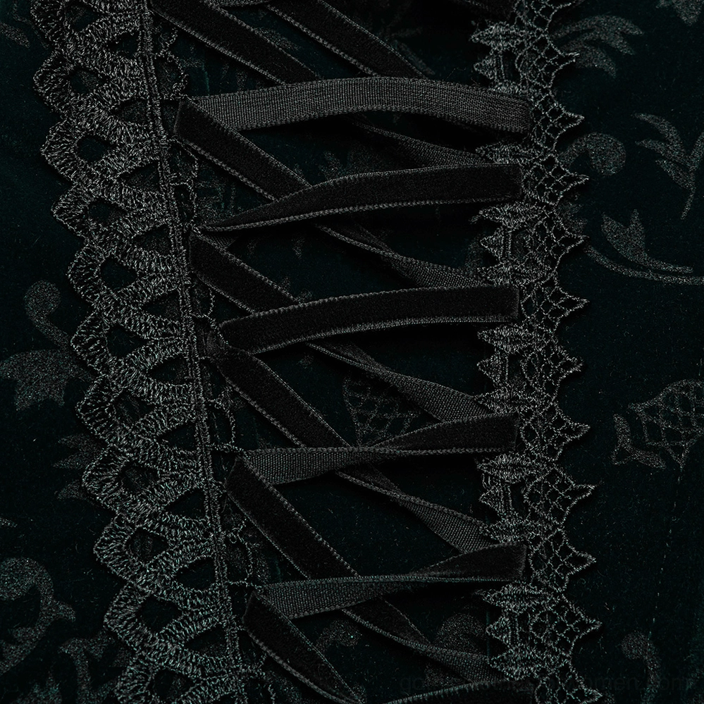 Side close-up of black corset lace trim showing embroidered lace edge, velvet ribbon lacing, floral velvet base fabric, and fine lacework detailing