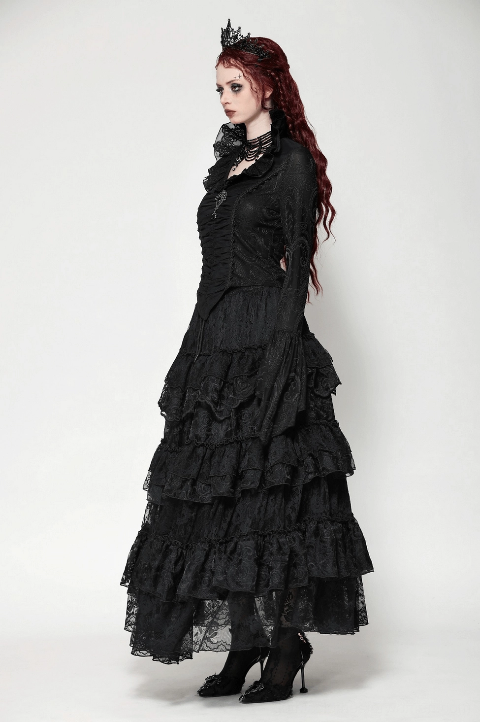 Size reference and fit guide for black Victorian gothic blouse showing garment dimensions across all sizes XS to XXL on studio background
