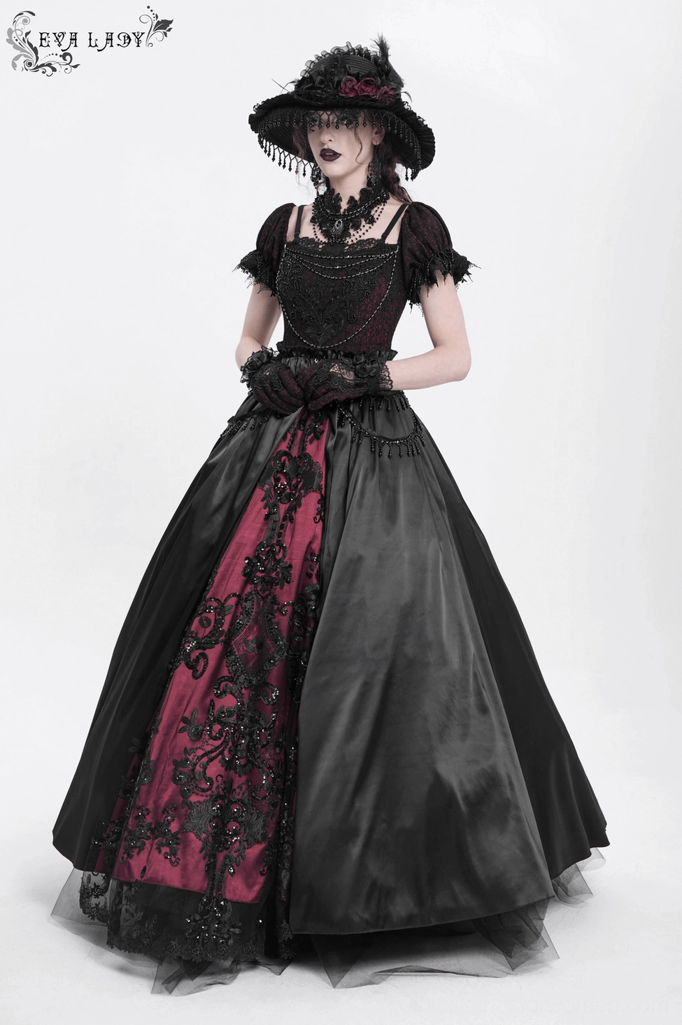 Mannequin display of black burgundy Victorian gothic formal dress featuring elegant two-tone color blocking and intricate design elements