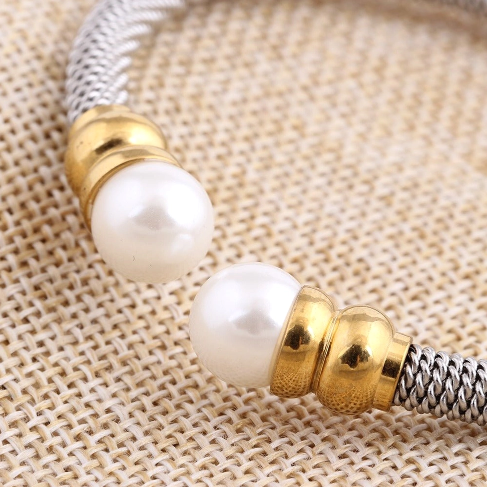 Complete view of antique silver and gold tone pearl cuff showcasing victorian gothic elegance