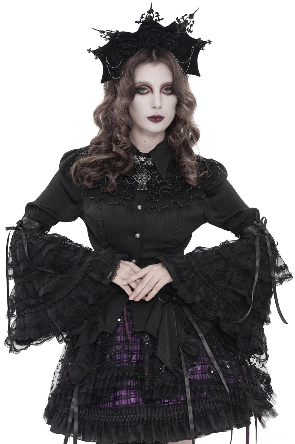 Black Victorian lace corset blouse with ruffled bell sleeves, front three-quarter view on model wearing gothic crown