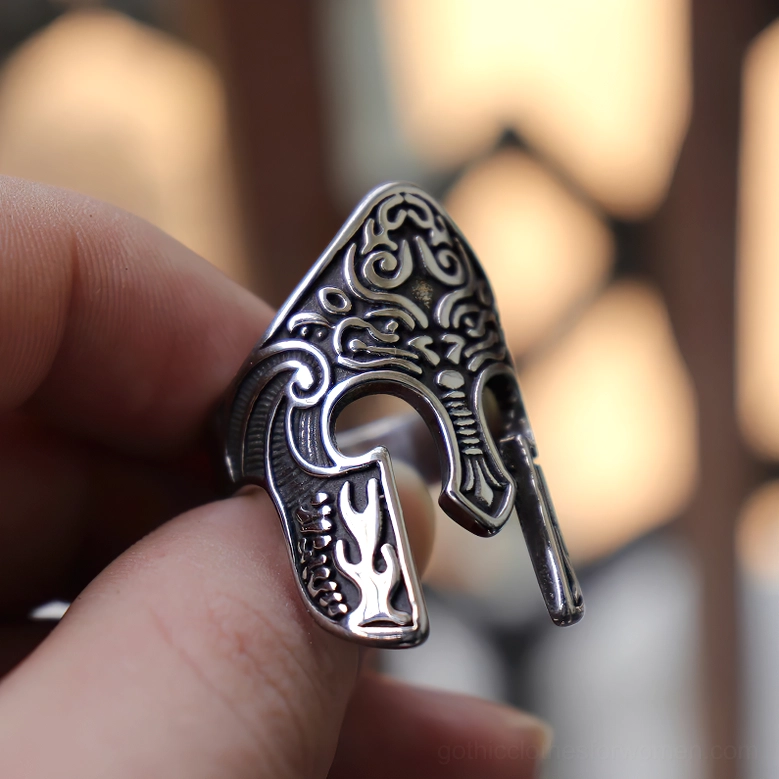 Gothic viking helmet ring held by hand side view showing ring band details