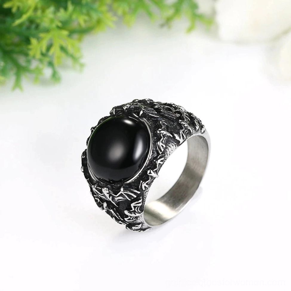 Vintage gothic black gem ring close-up side profile showing detailed carved metal texture and inlaid stone