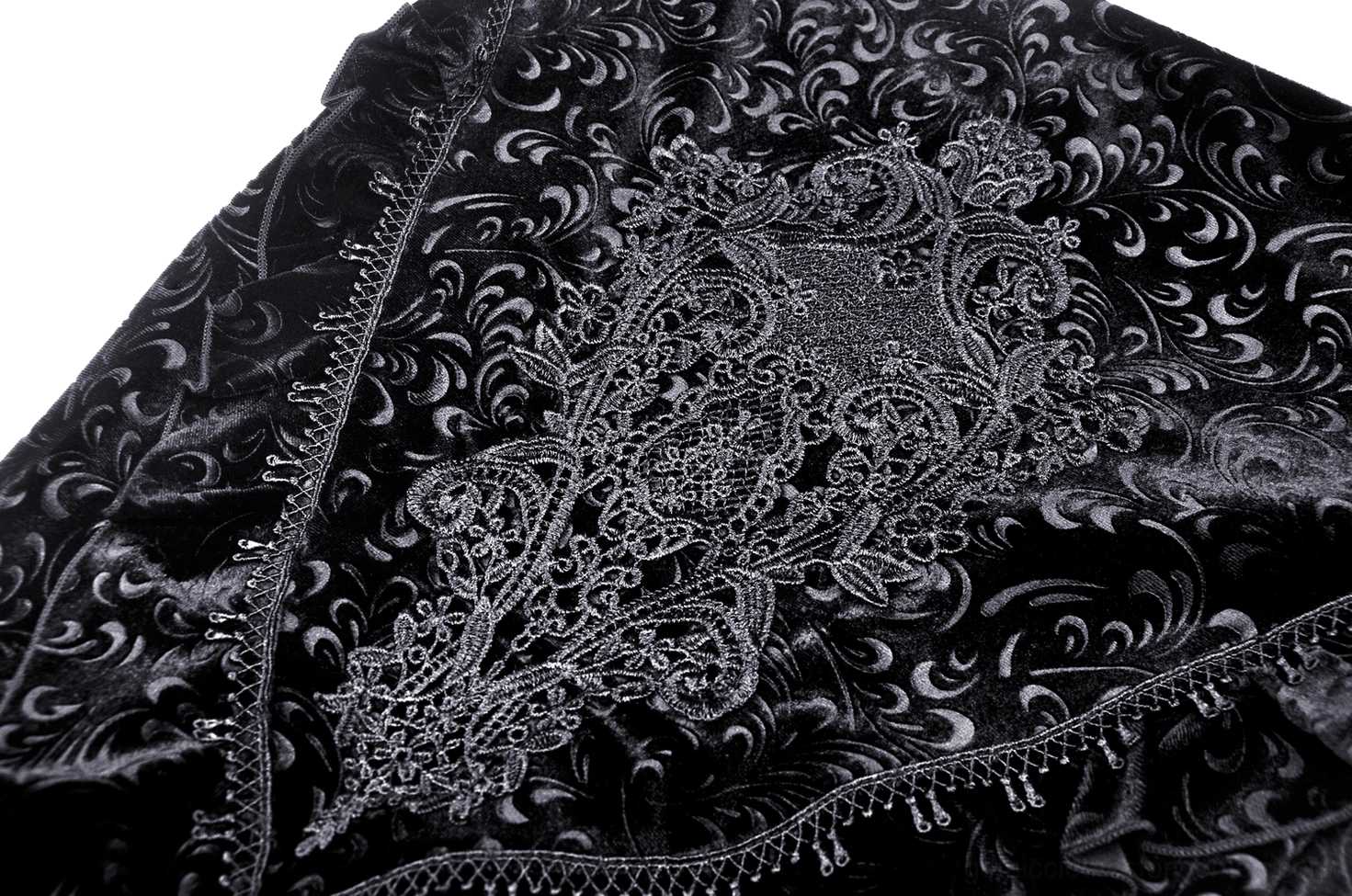 Vintage lace embroidery panel on black velvet fabric with beaded fringe trim textural detail