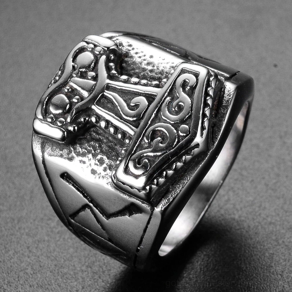 Vintage Mjolnir gothic ring with aged metal texture and detailed hammer engraving, 45-degree dark background view