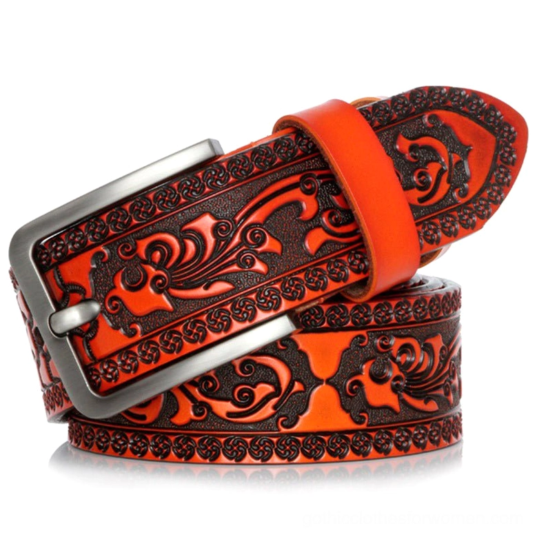 Orange-brown vintage leather belt with dark floral emboss pattern and silver pin buckle, front angled view
