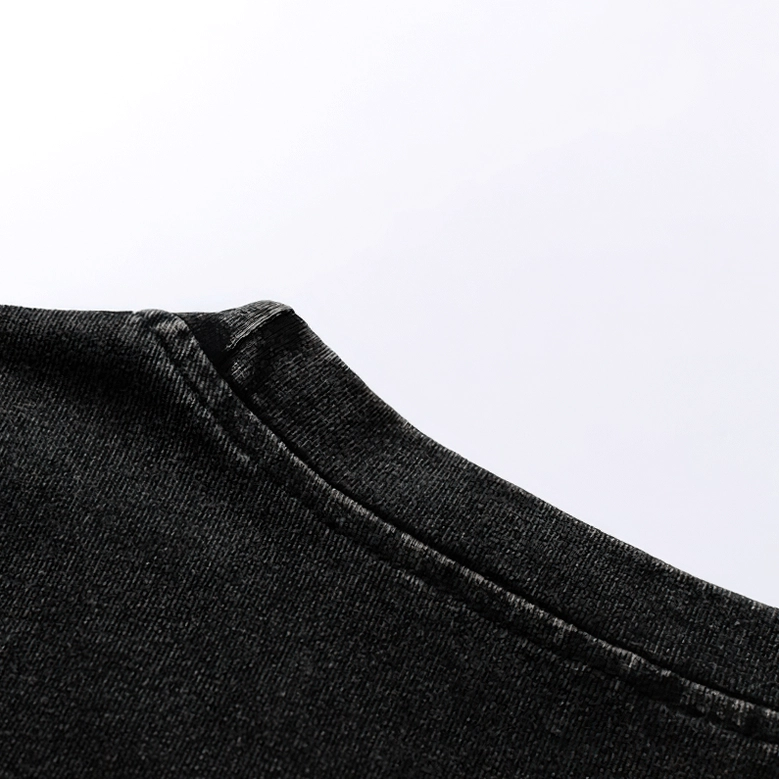 Fabric texture close-up washed black cotton oversized gothic tank top, vintage distressed finish