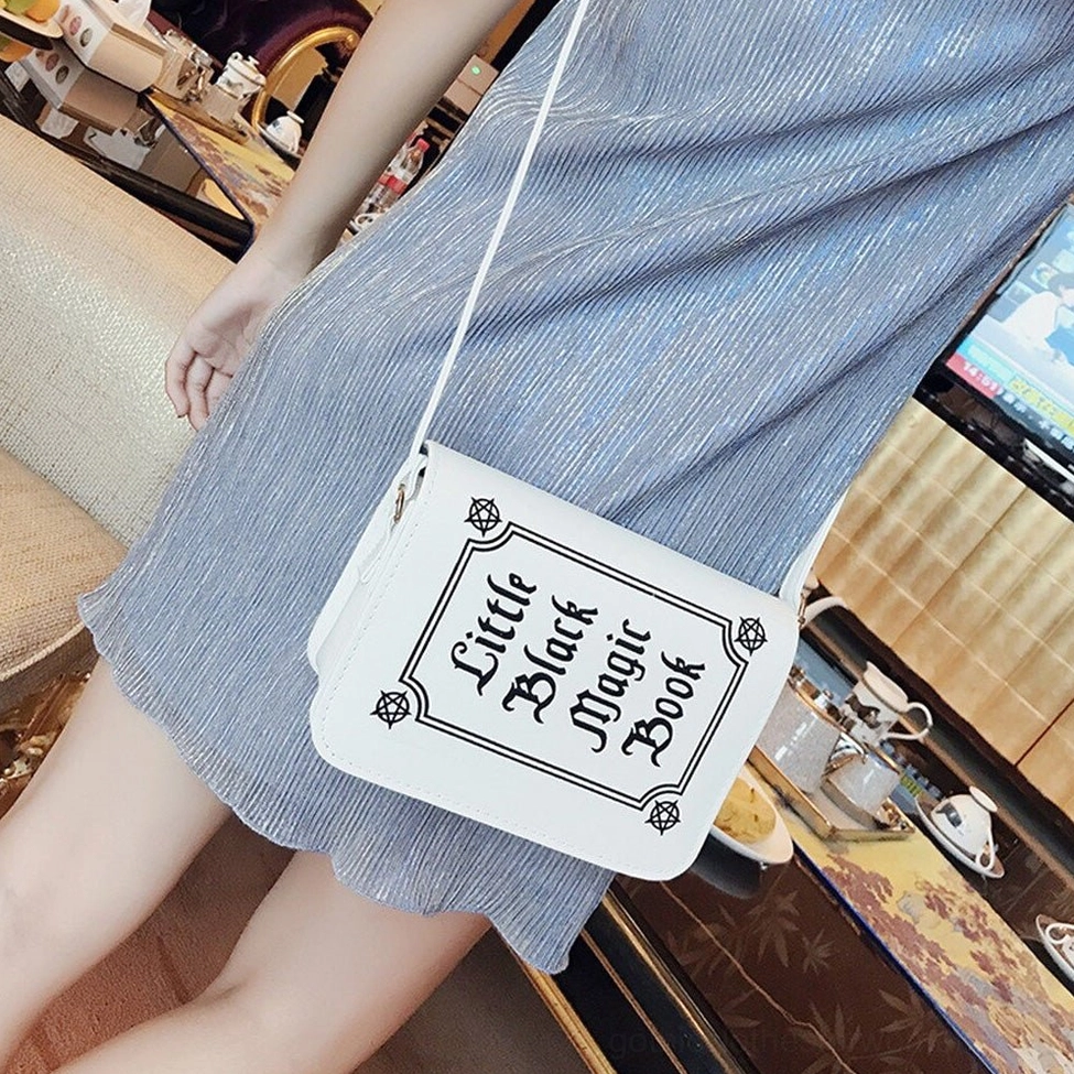 White gothic letter printing crossbody bag front panel with detailed symbolic gothic text design