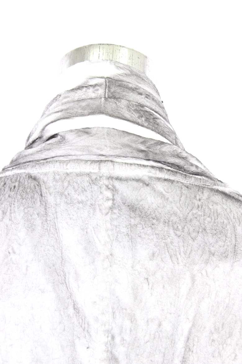 Close-up of white gothic blouse collar with distressed fabric and black piping trim detail