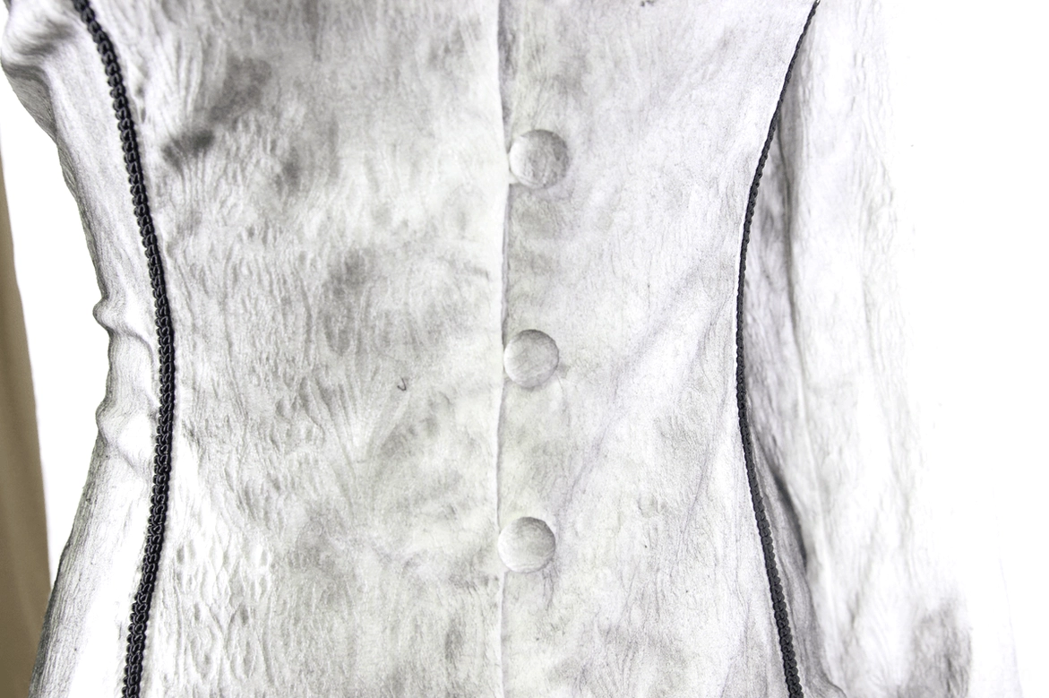 Close-up of white gothic blouse front button placket with black vertical piping trim